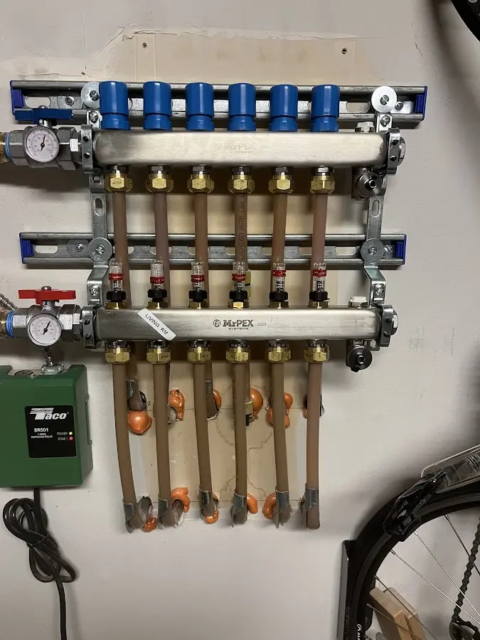 Plumber performing Water Heater Repair at a residential property in Ashville